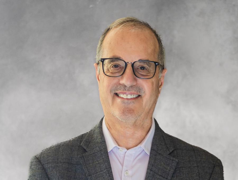 A headshot of Peter Burney, Senior Vice President, Strategic Programs, mLogica