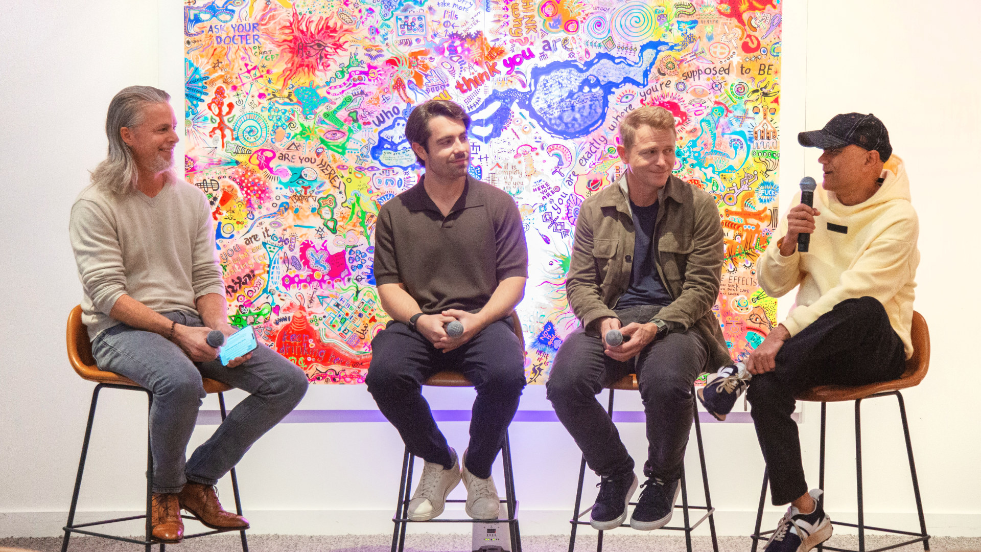 A photo of the Cockroach Connect AI panel on "AI Is Completely Rewriting What Scale Means." Spencer Kimball, co-founder and CEO of Cockroach Labs moderated. Seated with him are Peter Fenton (Benchmark), Satish Dharmaraj (Redpoint Ventures), and Lucas Swisher (Coatue).