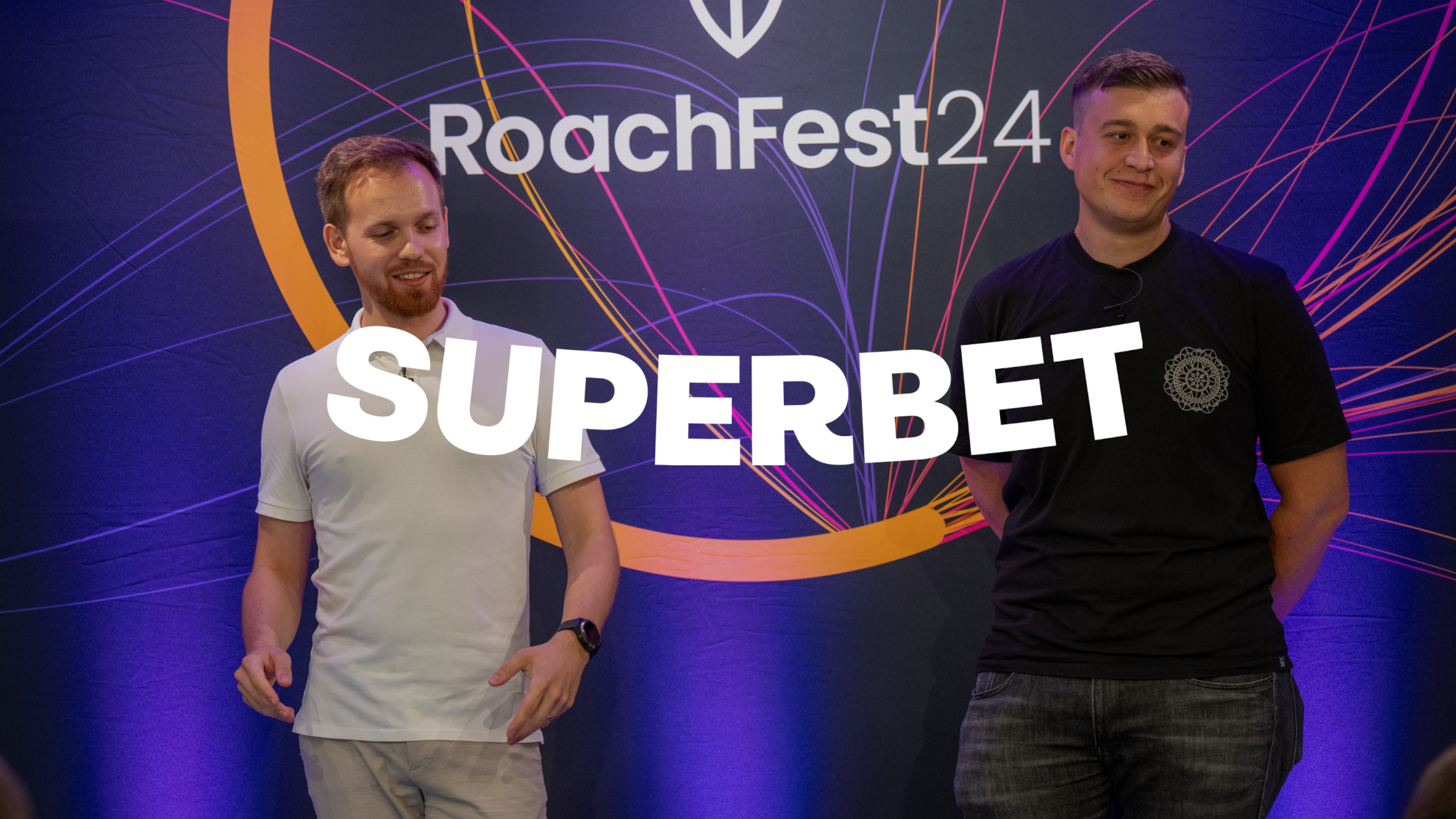 Photo of Sergej Jakovljev, Senior Site Reliability Engineer at Superbet, and Ivan Hrastinski, Engineering Manager at Superbet on the RoachFest24 stage in London, with the Superbet logo superimposed.