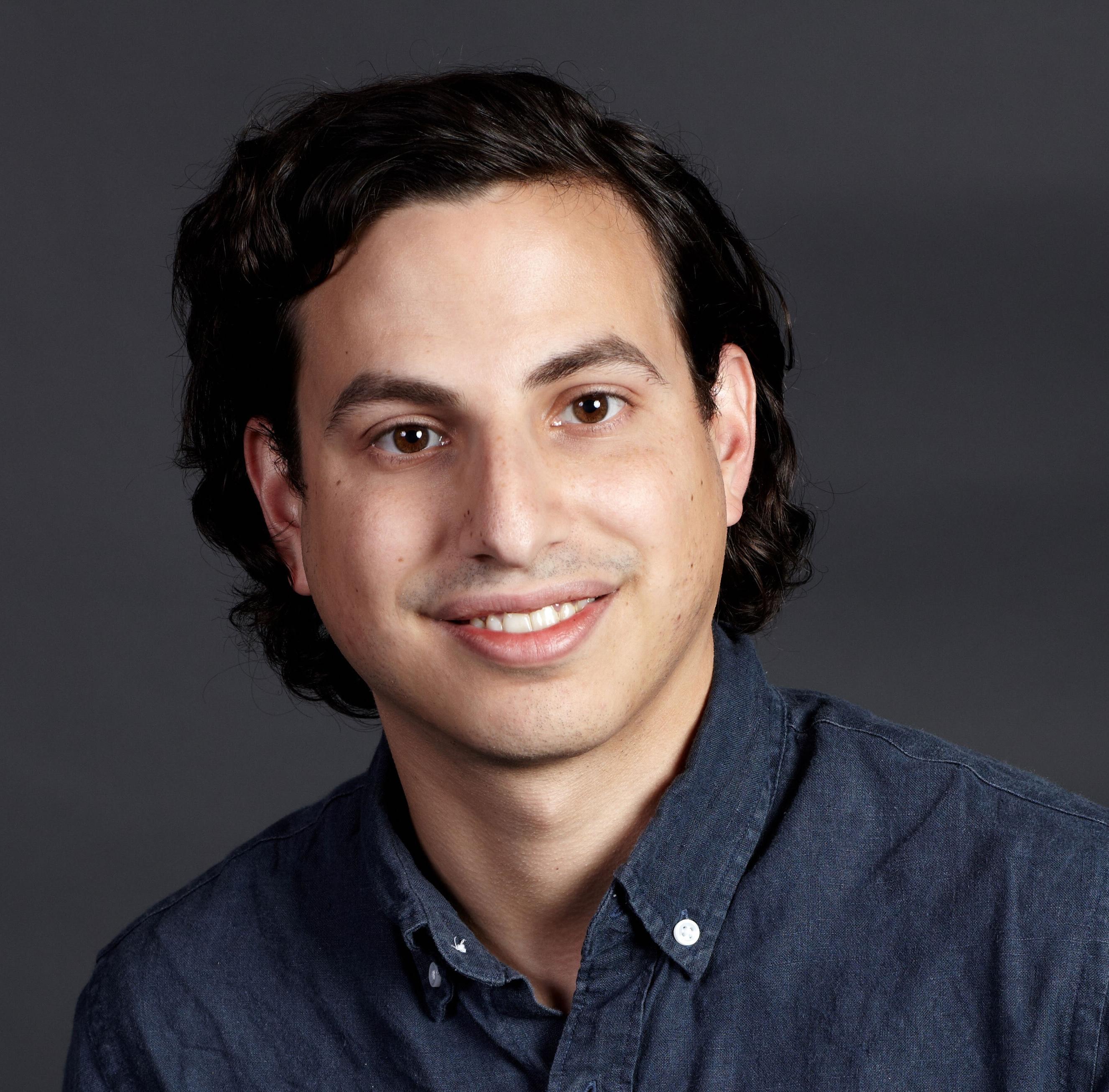 A headshot of Elliot Kartus, Staff Corporate Security Engineer at Cockroach Labs.