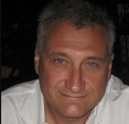 A headshot of Alex Entin, Senior Staff Sales Engineer at Cockroach Labs.