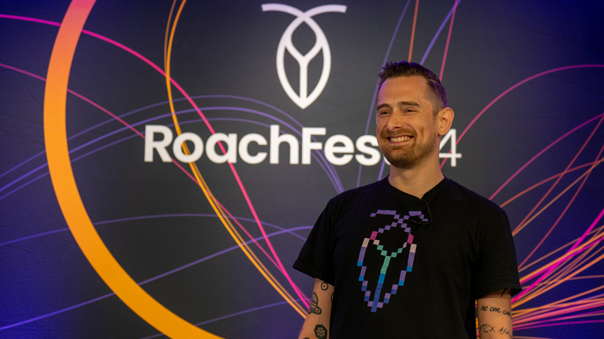 An image of MC Rob Reid onstage at RoachFest24 in London.