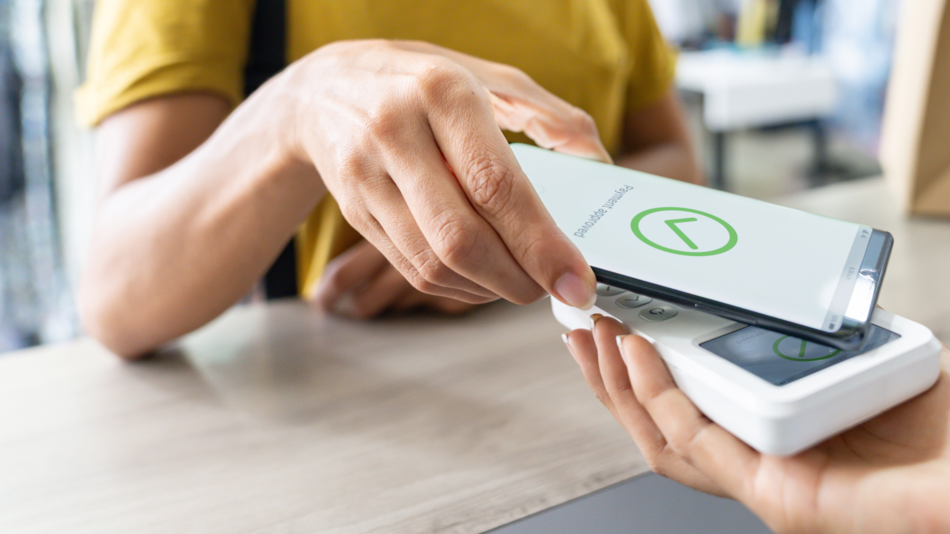 An image of a customer making a POS digital payment.