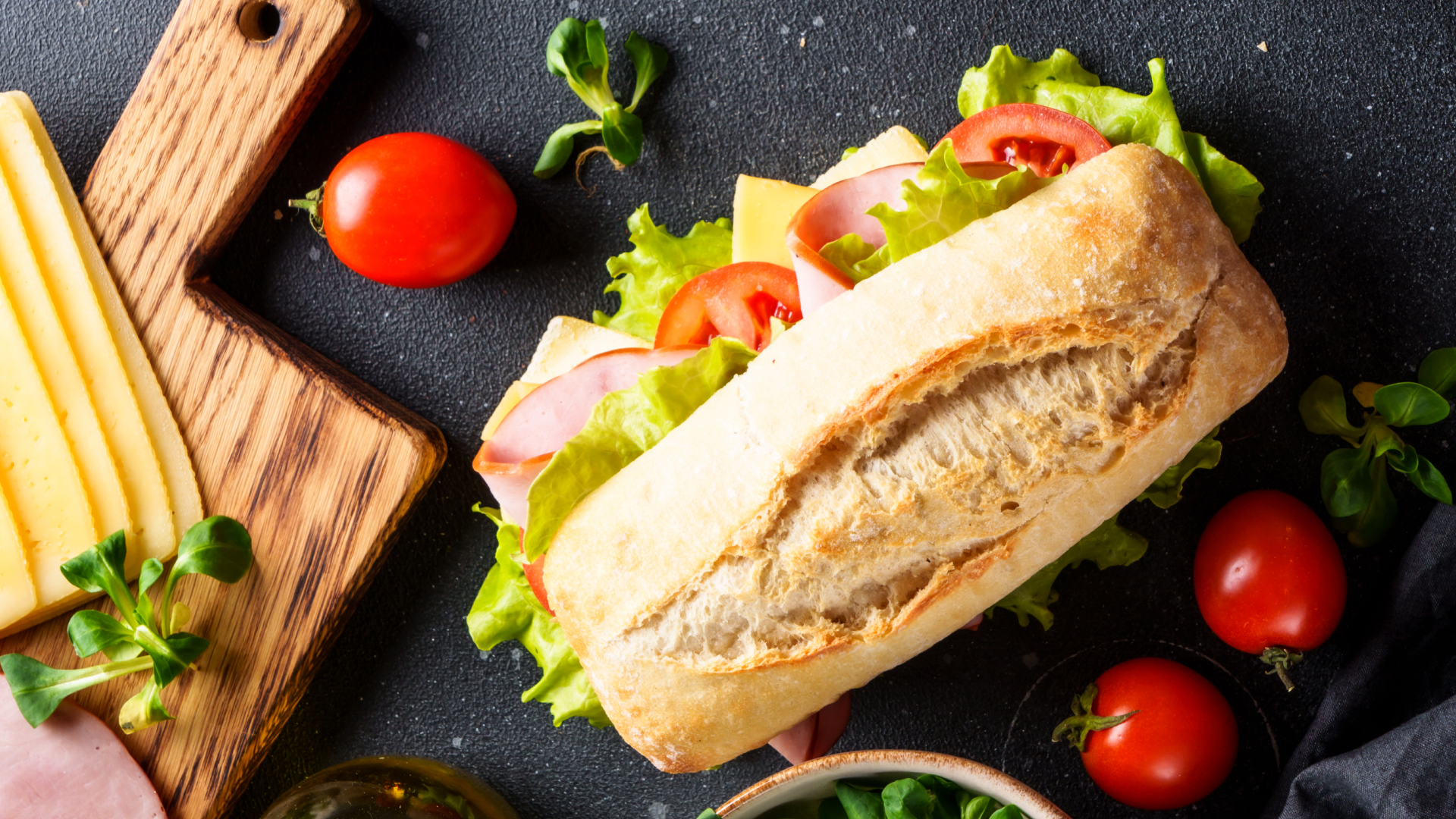 Sandwich being assembled with fresh ingredients, illustrating workload balancing and resource sharing between foreground and background tasks.