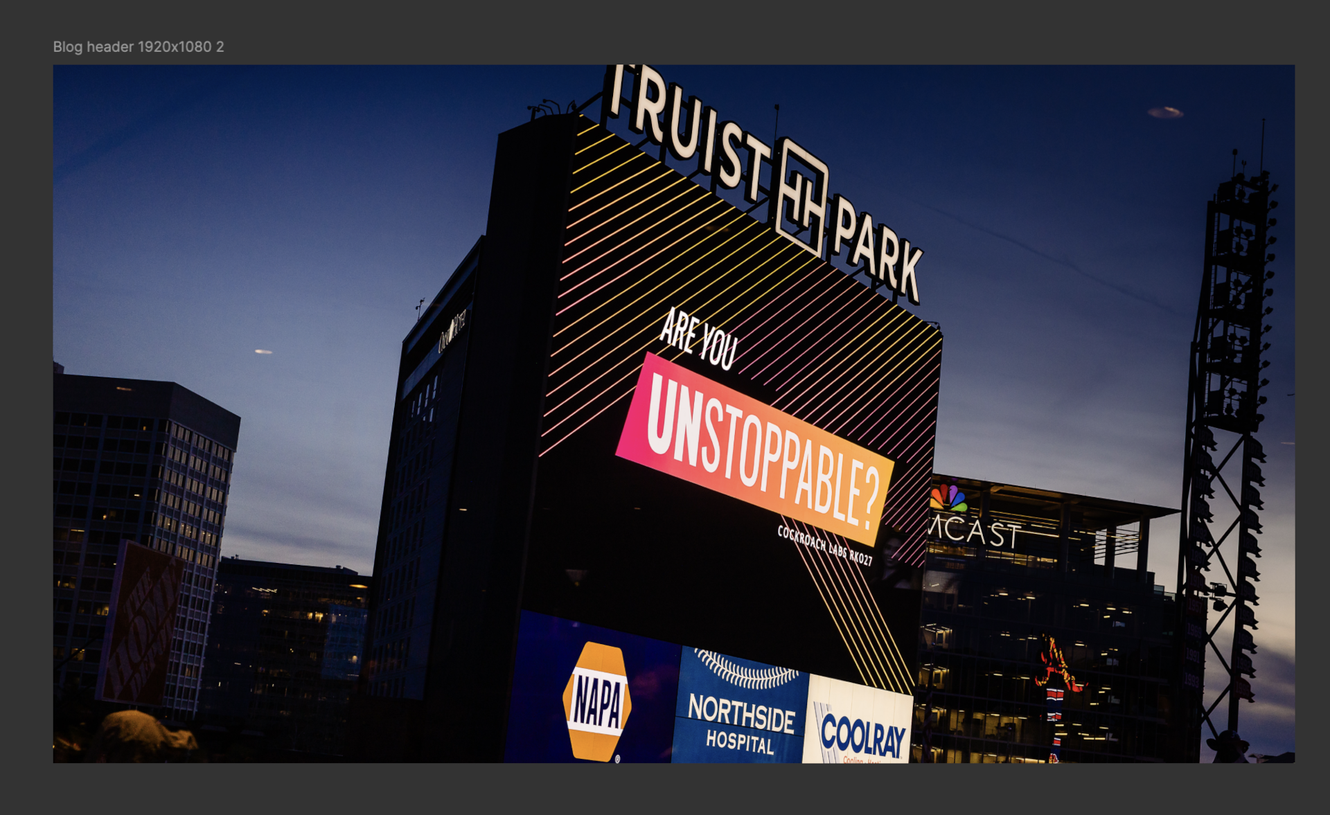 Truist Park scoreboard in Atlanta displaying “Are You Unstoppable?” during CockroachDB's RKO 2026, highlighting the event’s theme and evening atmosphere.
